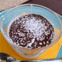 Vegan pannacotta with chocolate at Quinoa in Florence