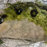 Taco with beans, pesto, olives, guacamole, corn salsa, rice  at Illegal Pete's in Greenwood Village