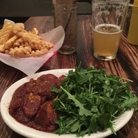 Waffle fries and vegan Currywurst  at Frank in Austin