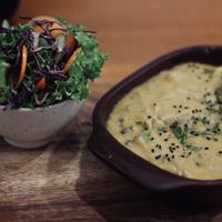 yellow pepper stew with salad  at Siembra in Lima