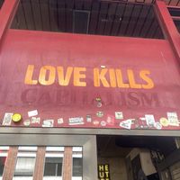 Love K*lls Capitalism Signage  at Lost Weekend in Munich