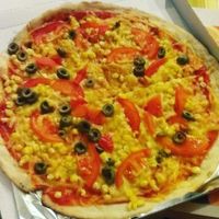 one pizza with vegan cheese from delivery at Pizza Caesar in Bratislava