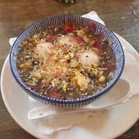 Mochi filled with sesame paste in a flower broth. Absolutely delicious! at Tianfuzius in Berlin