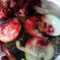 Fully dressed kale burger on handmade buns. at Amazing Kale Burger in Evanston