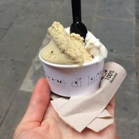 Delicious vegan ice-cream with pistaccio and almond with orange at Heladeria Gocce di Latte in Barcelona