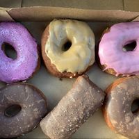 Pink ring, maple ring, and two shapes for chocolate  at Casual Friday Donuts in Spokane
