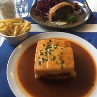 Francesinha, fries and lentil Wellington at Lupin Restaurante Vegetariano in Porto