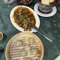 Clockwise from top: eggplant, stinky tofu, Vegan xiaolongbao (soup dumplings), and hongshao fish (fried soy sauce fish)  at Jīng Yuán SùShí Guǎn 京園素食館 in Taipei