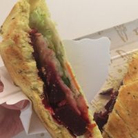 Vegan sandwich with beetroot, salad, sweetpotatoes, carrots and turmeric bread at Brunchy Bar in Padua