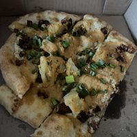 Loaded baked potato flatbread pizza (with two pieces missing)  at Allie's Vegan Pizzeria and Cafe in Spokane