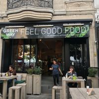 Front entrance, nice wood furniture outside, when the weather is good is the best place to eat at Greenway in Antwerpen
