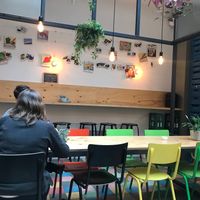 backroom with the wall decorated with photos and drawings of vegetables  at Greenway in Antwerpen
