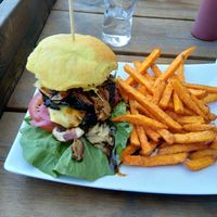 Burger with portobello patty and sweet potato fries at The Vegan Bar in Malmo