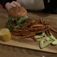 Green Goddess Burger with Soy Patty with sweet potato fries and corn on the cob   at The Vegan Bar in Malmo