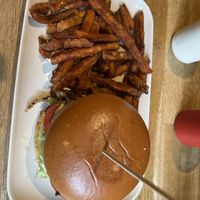 Philly Cheessteak Burger with Sweet potato fries  at The Vegan Bar in Malmo