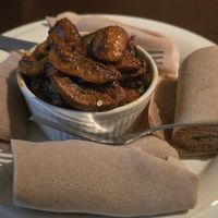 Mushroom Tibs (sautéed mushrooms, tomatoes, jalapeños, and onions in a tantalizing blend of Ethiopian spices). at Hawi Ethiopian Restaurant in Ithaca
