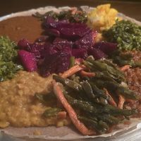Vegan Veggie Combo; Misir (sp8cy red lentil stew), Kik (Sweet yellow split pea stew), Shiro (Spicy stew powdered split peas), Keysir (stewed red beets and carrots), Gomen (preparat at Hawi Ethiopian Restaurant in Ithaca