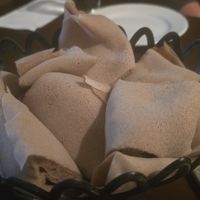 Injera (mixed teff and wheat, pure teff available with 24 hours advanced request) at Hawi Ethiopian Restaurant in Ithaca