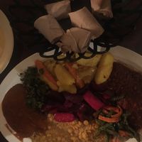 2 person sampler. It is AWESOMELY delicious, but would be so much better with some fresh greens. It was also a bit small for two at that price/quality. at Hawi Ethiopian Restaurant in Ithaca