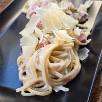 Carbonara with vegan ham and vegan shaved Parmesan at roots in Thessaloniki