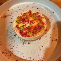 Vegan Cheesecake with Passionfruit and Freeze-Dried Raspberry at roots in Thessaloniki