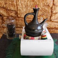 Interior of Andu Cafe - Gebena- A traditional container used to brew coffee at Andu Caffe in East London