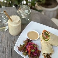 Black bean breakfast wrap & smoothie with dates and almond butter.  at Backyard Cafe - Riverside in Phnom Penh