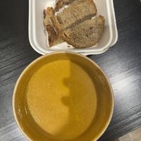 Carrot soup with sourdough bread  at Backyard Cafe - Riverside in Phnom Penh