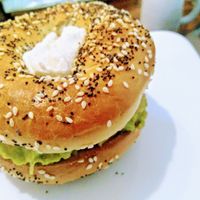 Avocado, tomato & cashew cheese bagel  at Backyard Cafe - Riverside in Phnom Penh