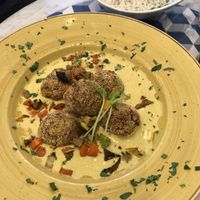 Vegan polpetta ( vegetable balls) in curry sauce with basmati rice.  at Casamadie in Cesena