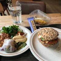 Chickpea Burger 8euros, and salad buffet by kilo 25e p/ kilo. raw wraps, pesto, sweet potatoes stew
 at Moonfood  in Brussels