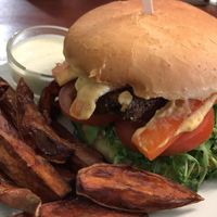 Seitan burger with sweet potato fries at GYVAS baras in Vilnius