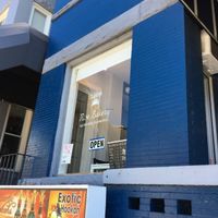 Window with hours at Rise Bakery in Washington