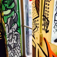 Doors adjacent artwork  at Far East Taco Grille in Washington