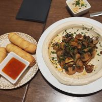 Taqueñas and hummus with grilled mushrooms at Hummus in Barcelona