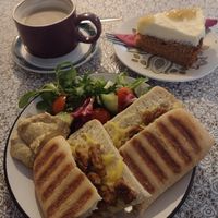 Tofu & vegan cheese ciabatta, soyamilk latte, & salted caramel apple cake. at The Cornerhouse Cafe in Berwick-upon-tweed
