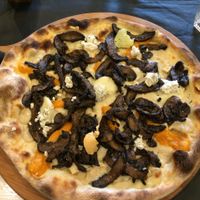 cheesy pizza with different kinds of vegan cheese and extra mushrooms at FED by Water in East London