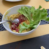 Hummus with onions on top   at Selezione Naturale in Turin