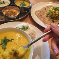 Thali, pakora curry with rice, scrambled paneer with a parantha. at Ranjit's Kitchen in Glasgow