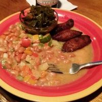 stew peas, plantains, collard greens, and red stripe. at Red Stripes Caribbean Cuisine and Lounge in Bluffton