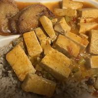 The BEST Caribbean Vegan Dish I’ve ever had. Pigeon peas, brown stew Tofu and Plantains. Chef’s Kiss 💖  at Red Stripes Caribbean Cuisine and Lounge in Bluffton