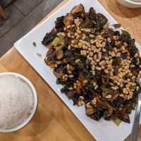 Mushrooms with flaky seaweed and pine nuts at Bodhi Kosher Vegetarian Restaurant in New York City