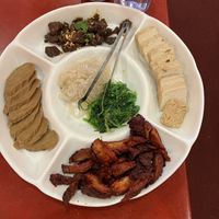 Appetizer plater- beef jerky, BBQ meat, chicken, jelly fish, fresh seaweed. BBQ our fav!  at Bodhi Kosher Vegetarian Restaurant in New York City