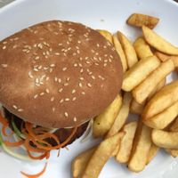 spicy burger and chips  at Loving Hut - North Laine in Brighton