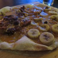 Customised sweet pizza: one half with bananas and the other one with dried figs at Pizza LAB in Leipzig