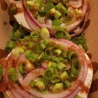 Multi national bagel with vegan cream cheese, onions, capers, and house made hot sauce at Los Bagels in Eureka