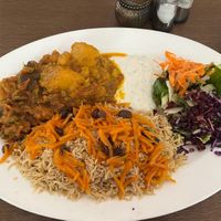 Rice dish with mixed veggies and potatoes plus salad on a huge plate  at Hindukusch in Hamburg