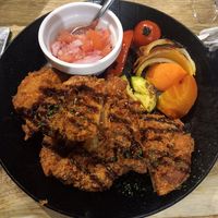 Thick-cut plant-based cutlets with veg and tomato and balsamic relish at The Restaurant at U2 in Onomichi