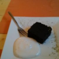Charcoal cake and vegan whipped cream. at Equilibrio in La Spezia