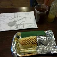 Generously-sized Pastor Burrito - tasty beyond words - accompanied by a refreshing dark lemonade. at Momencik in Warsaw